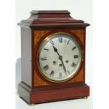 An early 20th century George III style bracket clock, the silvered dial with Roman numerals, the