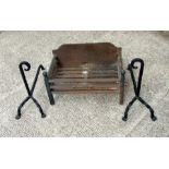 A cast iron fire grate, 52cms wide; together with a pair of wrought iron fire dogs (2).