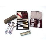 A boxed set of six continental silver (800 grade) spoons; together with a pair of silver sugar