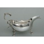 A silver sauce boat on three shell capped legs, London 1971, weight 226g.