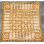 An Art Nouveau or Art Deco damask woven tablecloth decorated with sprays of flowers within a