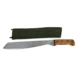 A machete with wooden handle, in a canvas sheath, 47cms long.