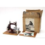 An Essex miniature sewing machine in original box.