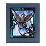 A stained glass panel depicting a bird in flight, framed, the glass 31 by 25cms.Condition ReportGood