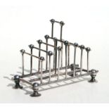 A Victorian Christopher Dresser design silver plated six-division toast rack with impressed maker'