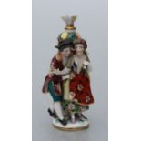 A 19th century continental porcelain figural group scent bottle with gilt anchor mark, 9cms high.