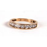 A 9ct gold and white stone half-hoop eternity ring, weight 1.9g, approx UK size 'L'.