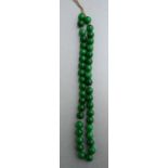 A string of jade or hardstone beads, each bead approx 12mm diameter.