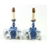A pair of Chinese blue & white candlesticks in the form of elephants, converted to table lamps,