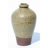 A Chinese proto-porcelain style vase with incised decoration, 16cms high.