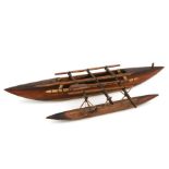A wooden model of a Kiribati outrigger Pacific Ocean boat, 74cms long.