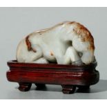 A Chinese figured jade carving in the form of a recumbent horse, 7.5cms longCondition ReportMinor