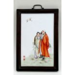 A Chinese Republic rectangular porcelain panel decorated with a pair of robed figures with a crane