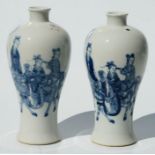 A pair of Chinese blue & white meiping vases decorated with figures and horses in a landscape, 23cms