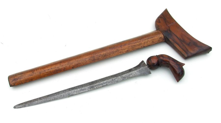 An Indonesian Kris in its wooden scabbard. Blade length 31cms (12.25ins)