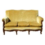 A French upholstered three-seater sofa.