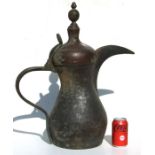 A very large Turkish / Islamic tinned copper dallah coffee pot, 59cms high.