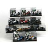 A collection of Quartzo 1:43 scale F1 Grand Prix winning cars including Ferrari 312 T2, Renault