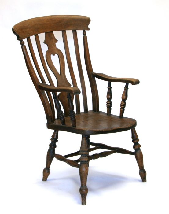 A 19th century beech and elm Windsor armchair with heart shaped pierced back splat, solid seat and