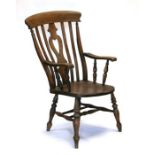 A 19th century beech and elm Windsor armchair with heart shaped pierced back splat, solid seat and