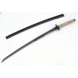 An 18th / 19th century Japanese katana sword in a lacquered wooden scabbard. Having an iron tsuba