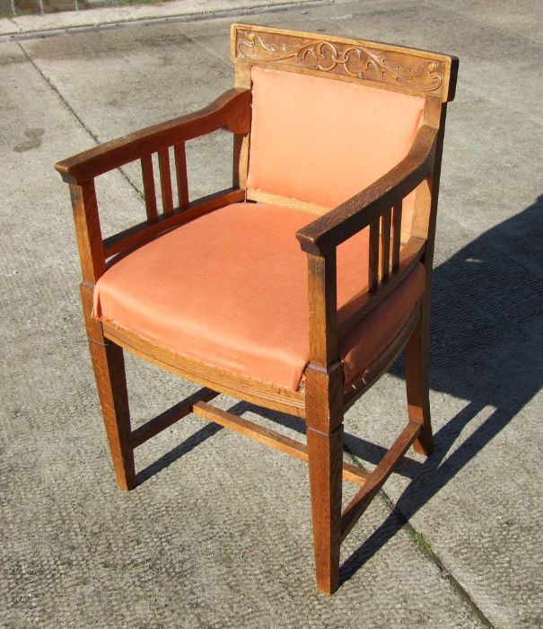 A continental Art Nouveau oak desk chair with upholstered seat and back.