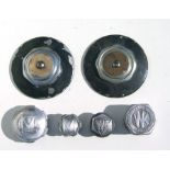 A pair of Alvis Ace type wheel hub covers, 7ins diameter; an Alvis aluminium wheel nut cover; and