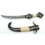 A good quality middle eastern jambiya dagger with bone inlay to the hilt and scabbard. Blade