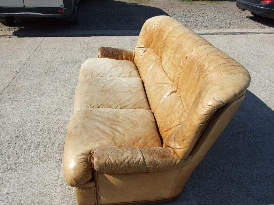 A distressed leather three-seater sofa. - Image 4 of 4