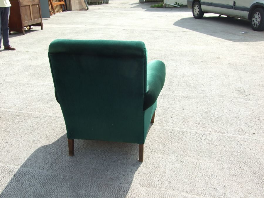 An Edwardian dark green upholstered armchair on square tapering front supports. - Image 2 of 3