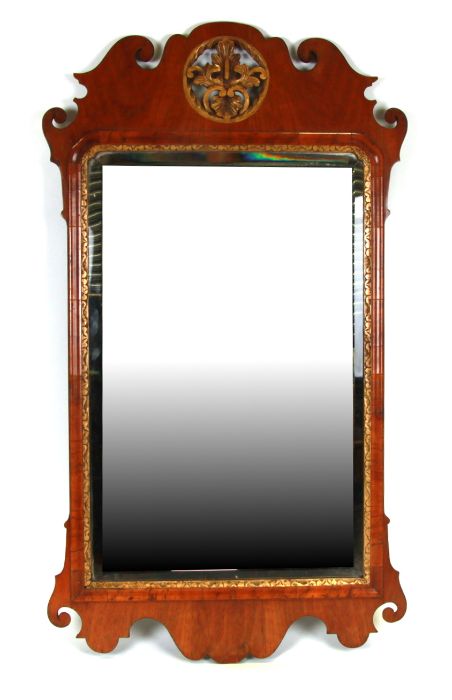 A 19th century walnut wall mirror with bevelled edge plate. overall 59cm by 104cm