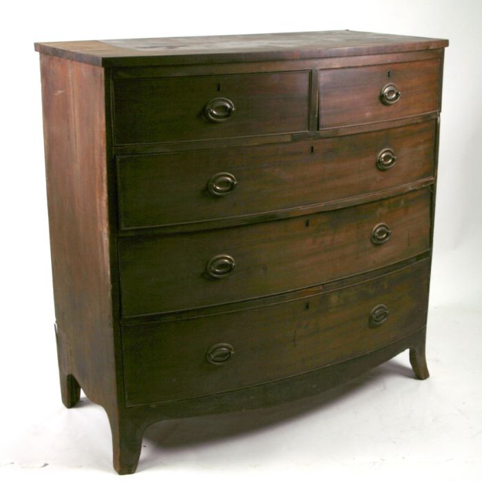 A 19th century bow fronted chest of drawers with two short and three long graduated drawers, on