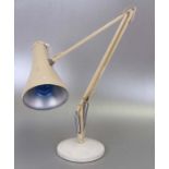 A Herbert Terry angle poise lamp on circular base.