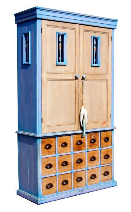 A continental painted pine larder cupboard on drawers, the upper section with a pair of panelled