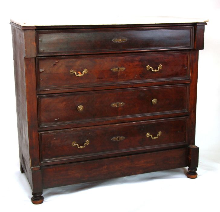 A Louis XVI style mahogany chest of drawers with rectangular marble top above four graduated