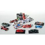 A collection of 1:24 and 1:43 scale diecast models and accessories including Jaguar E-type Roadster,