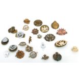 An assortment of 27 Army, Navy & Air Force badges