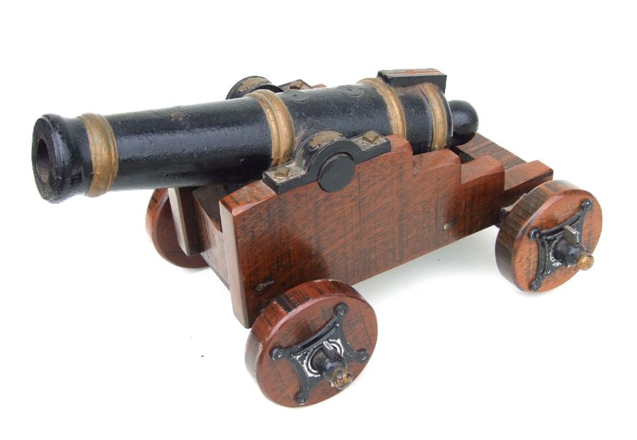 A 19th century cannon. Having a cast iron barrel 49cms (19.25ins) long with the vent hole being