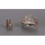 A Victorian miniature silver model of a Rococo style sofa, London import marks for 1899; together
