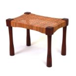 A mid century modern teak Thebes style stool with wicker work seat, 56cms wide.