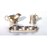 A Victorian silver mustard in the form of a tankard, engraved with foliate scrolls; together with