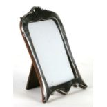 A silver shaped rectangular strut photo frame, marks rubbed, 14cms wide.