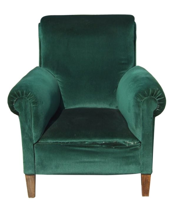 An Edwardian dark green upholstered armchair on square tapering front supports.