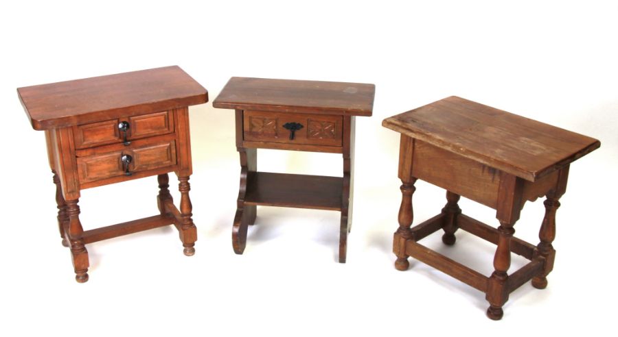 A 17th century style oak side table with two drawers, on baluster supports joined by a stretcher,