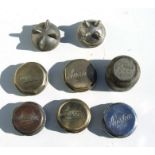 A set of four Austin brass era hub covers and others similar.