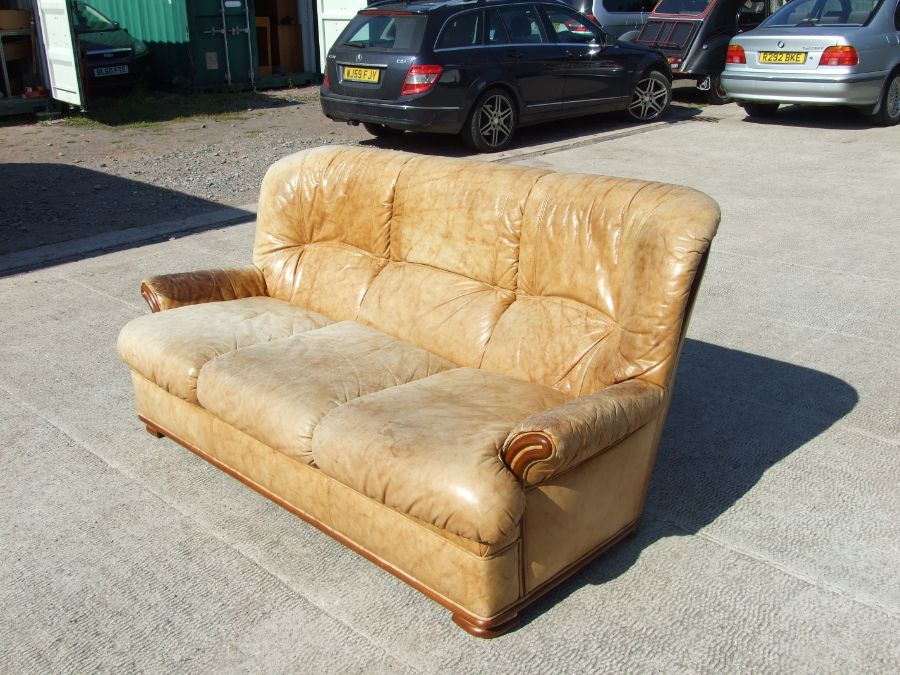 A distressed leather three-seater sofa. - Image 3 of 4