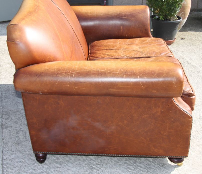 A contemporary moustache back two-seater leather sofa, approx 145cms wide.Condition ReportThere is a - Image 2 of 5