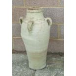 A large four-handled terracotta olive jar, 77cms high.