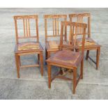 A set of four continental Art Nouveau oak dining chairs (4).