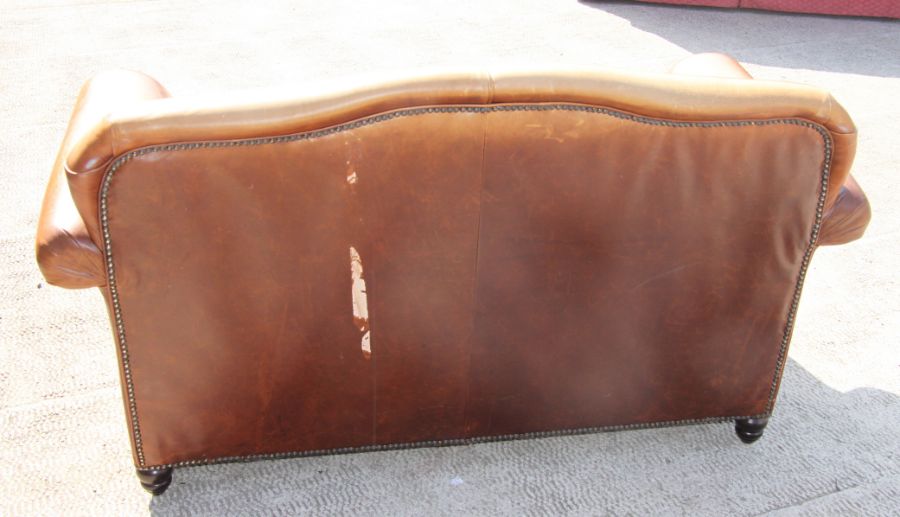 A contemporary moustache back two-seater leather sofa, approx 145cms wide.Condition ReportThere is a - Image 4 of 5